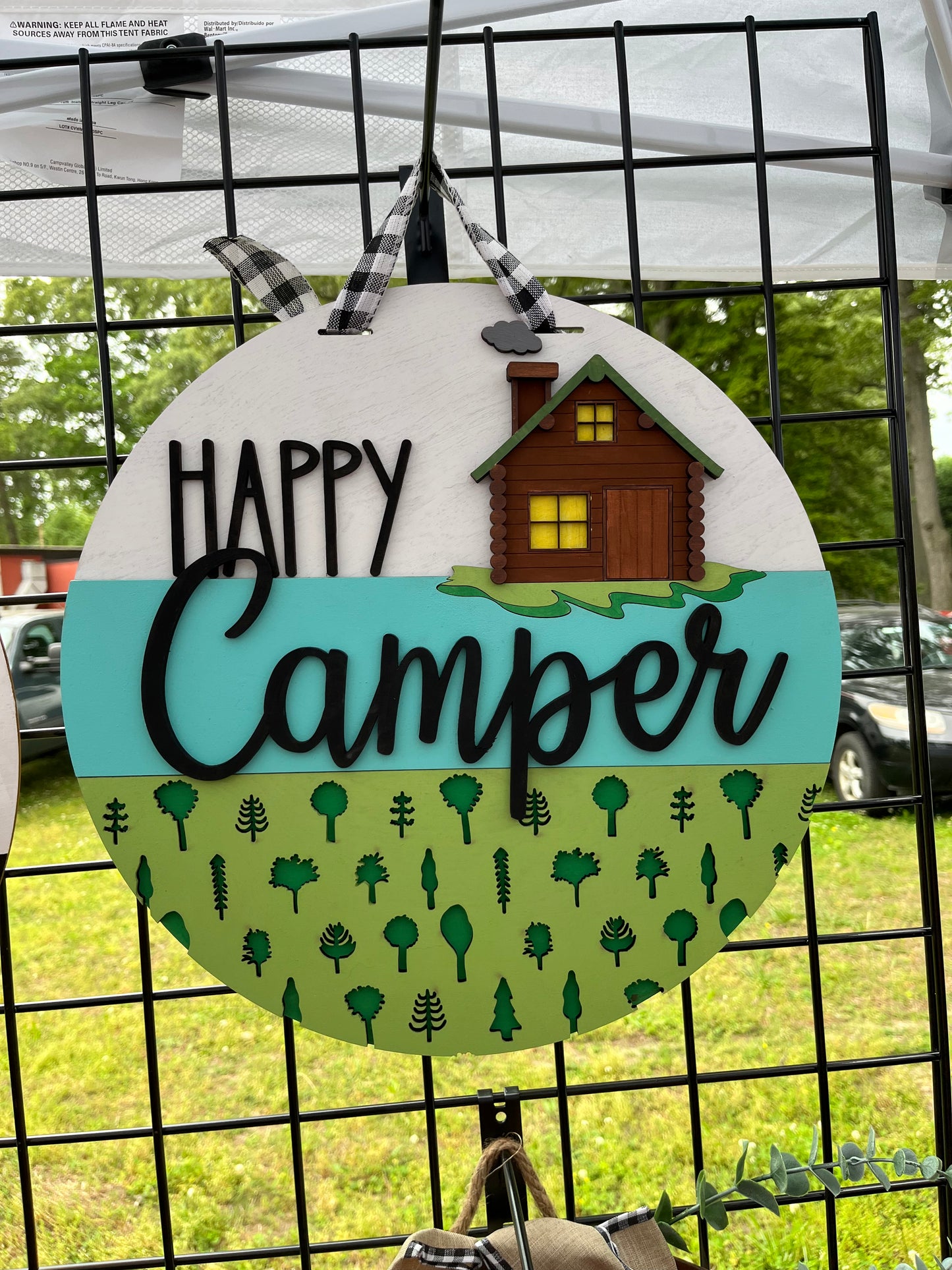 Happy camper with cabin door hanger